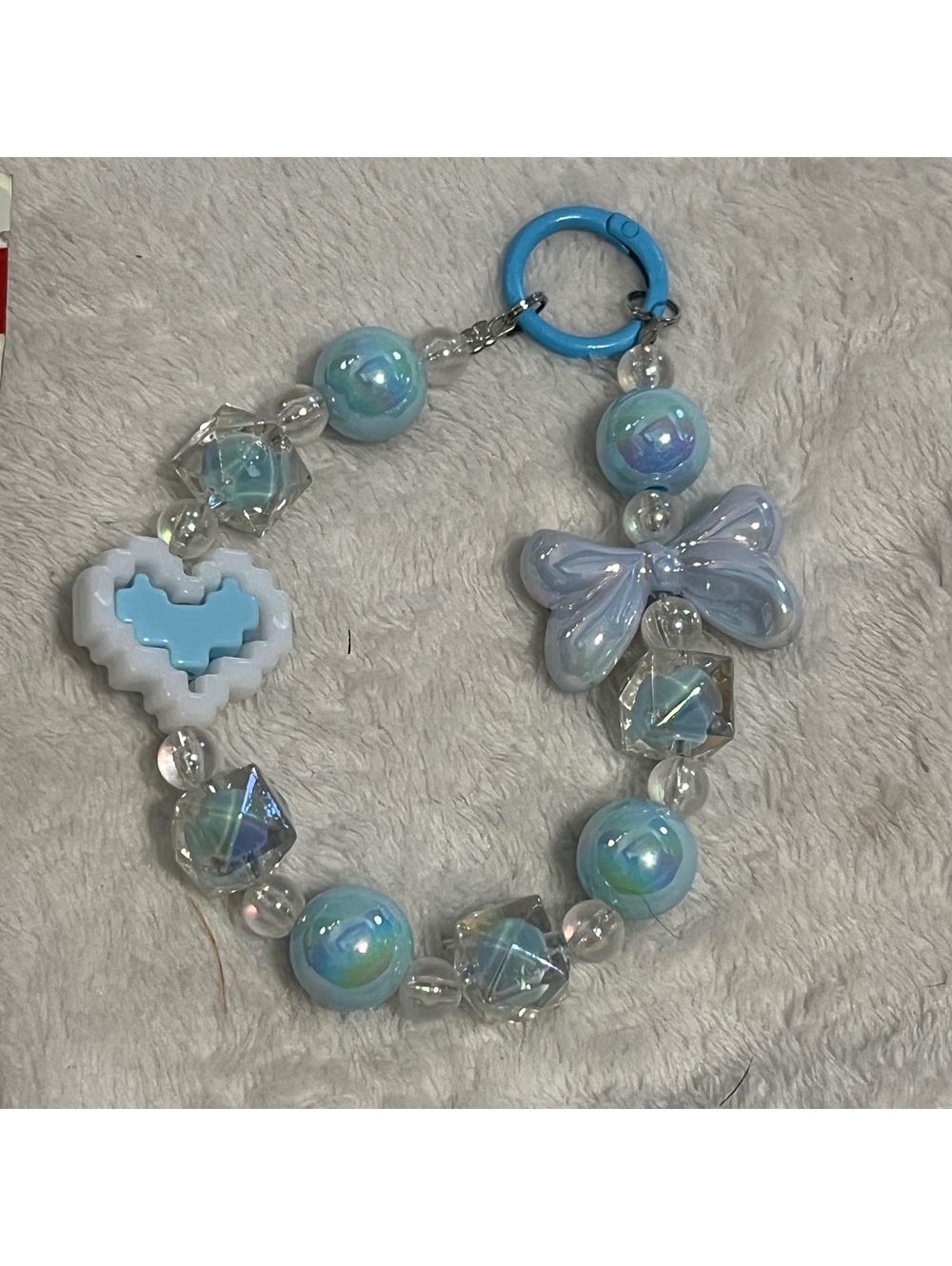 Blue beaded bracelet with bow charm